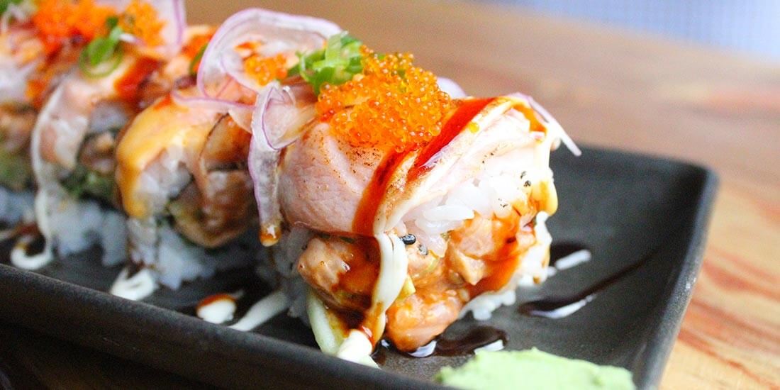 Spicy seared salmon sushi with avocado and cucumber