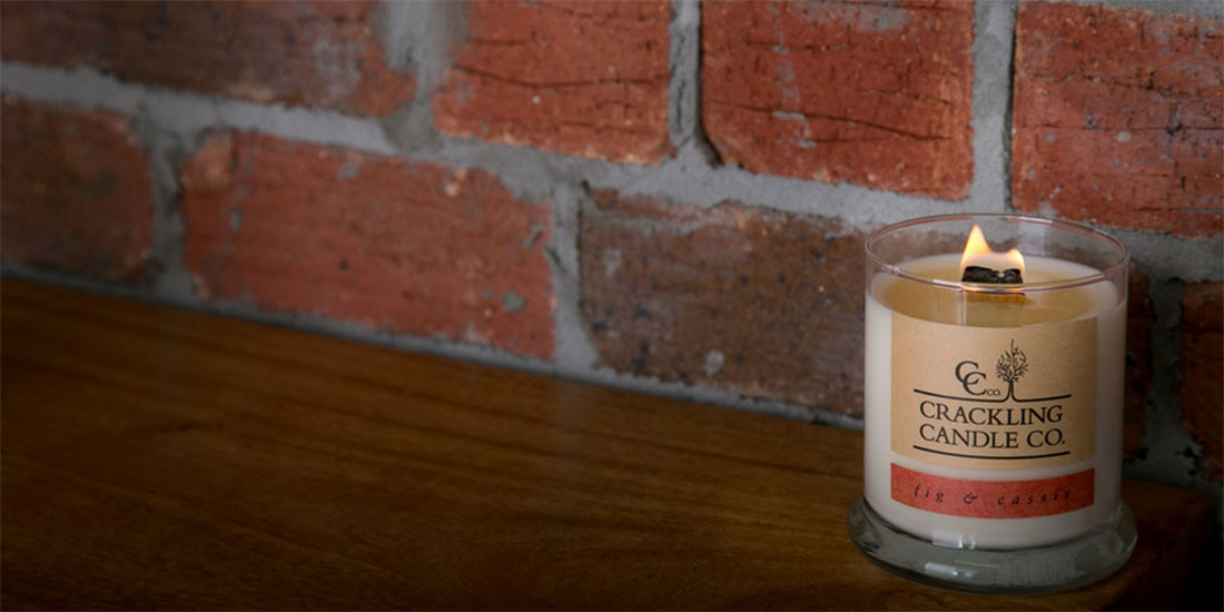Experience the beauty of a wooden-wick candle by Crackling Candle Co.