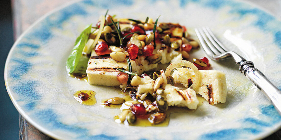 Treat your guests to grilled haloumi with pomegranate and sumac dressing