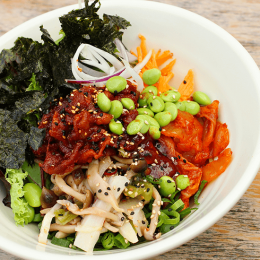 Spicy pork bibimbap with vegetables and spicy sauce