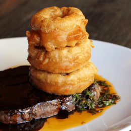 Cape Grim rib fillet with onion rings, chimichurri salsa and jus
