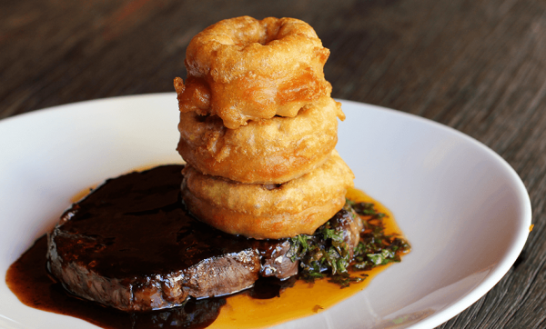 Cape Grim rib fillet with onion rings, chimichurri salsa and jus