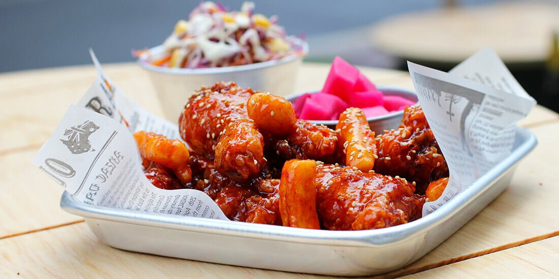 Korean chilli chicken with beetroot and radish pickle and coleslaw