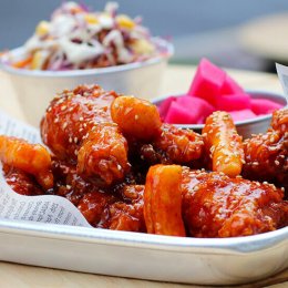 Korean chilli chicken with beetroot and radish pickle and coleslaw