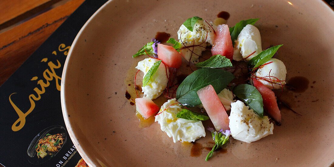 Caprese salad with watermelon, mozzarella, mint, grape and basil