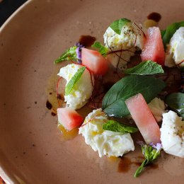 Caprese salad with watermelon, mozzarella, mint, grape and basil