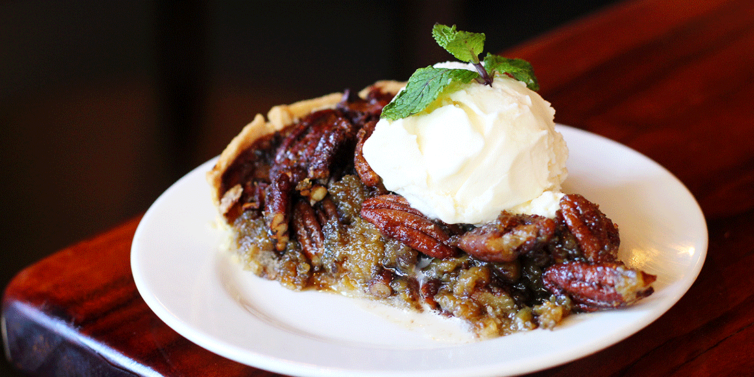 Homemade pecan pie served with vanilla ice-cream