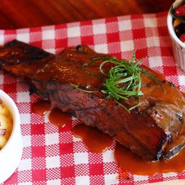 Beef brisket served with mac 'n' cheese and Cowboy Caviar