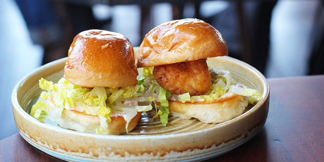 Battered prawn rolls, lettuce and sriracha prawn mayonnaise on a toasted milk bun