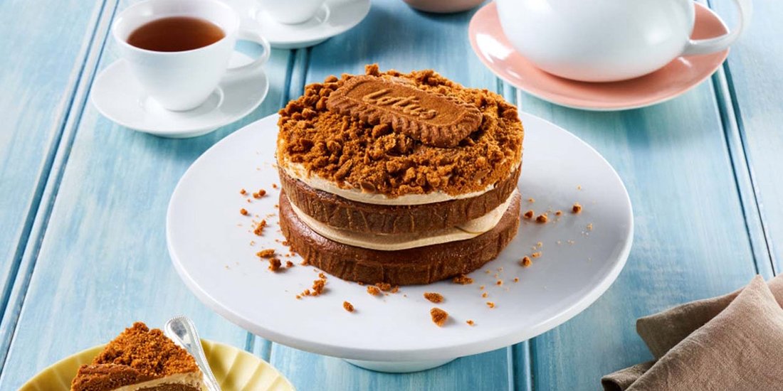 Woolworths is slinging an $8 vegan Biscoff layer cake and Lotus celebrate this victory
