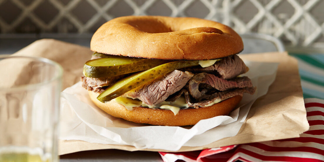 Treat yo'self to a salt beef bagel with hot English mustard and pickles