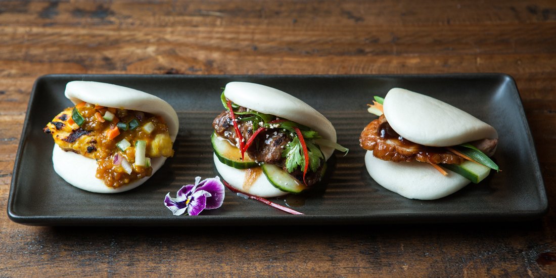 Munch on hamburger baos and sip Asian-inspired cocktails at Noodle Bao & Bar