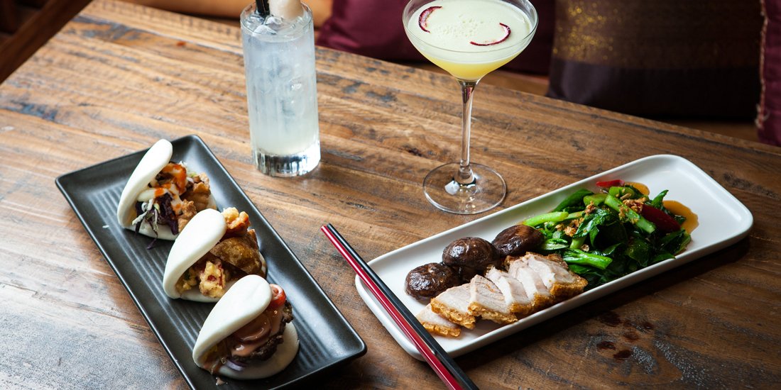 Munch on hamburger baos and sip Asian-inspired cocktails at Noodle Bao & Bar
