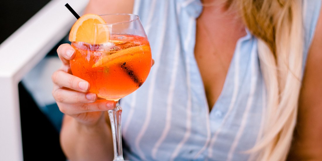 Sip spritzes in the sunshine at Aviary Rooftop's bottomless brunch event