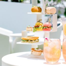 Let's sip! QT has launched an outdoor summer high tea featuring bottomless jugs of Aperol