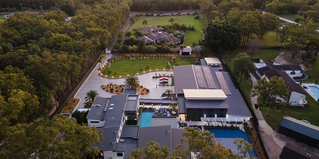 This impressive Brisbane house comes complete with a mancave, outdoor cinema, soccer field and two gyms